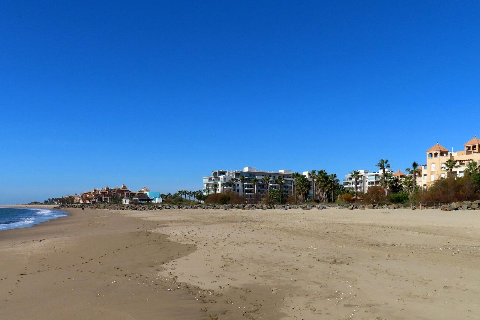 Isla Canela beach with residential buildings behind the dunes