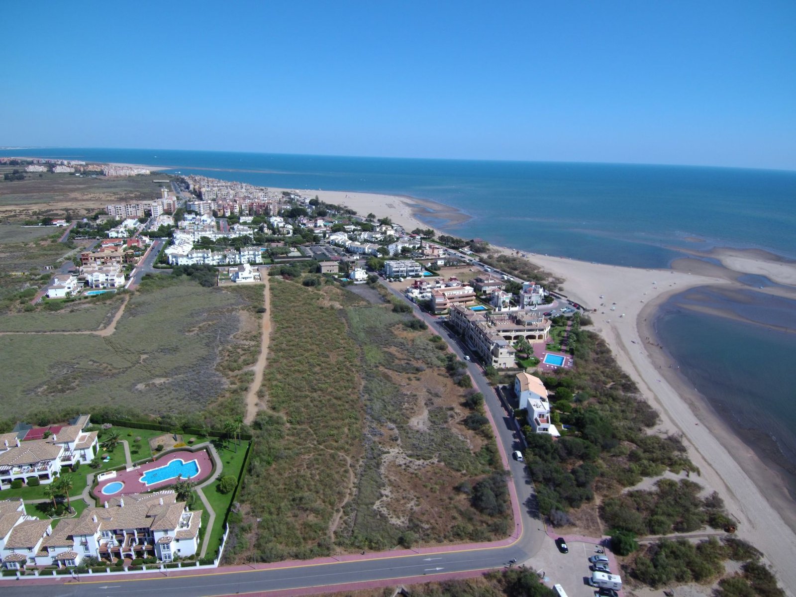 Aerial view of Isla Canela's beachfront and low-rise residential developments, Ayamonte