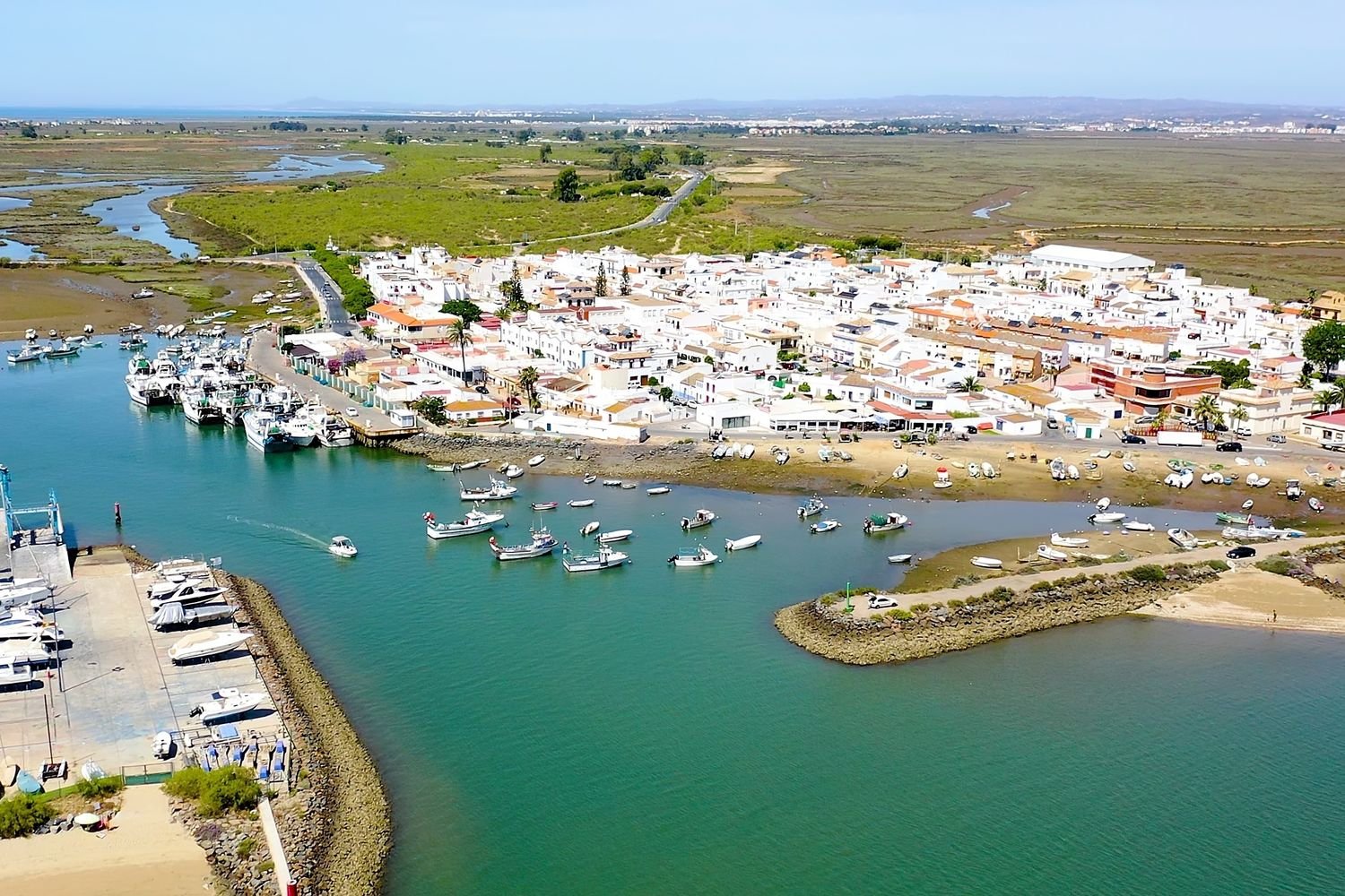 Aerial view of the fishing village and port of Punta del Moral on the Carreras river